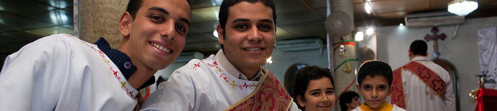 young men at a religious ceremony